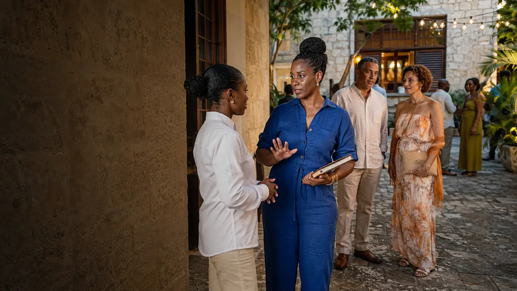 A Barbadian event organiser welcoming guests with her entrance team