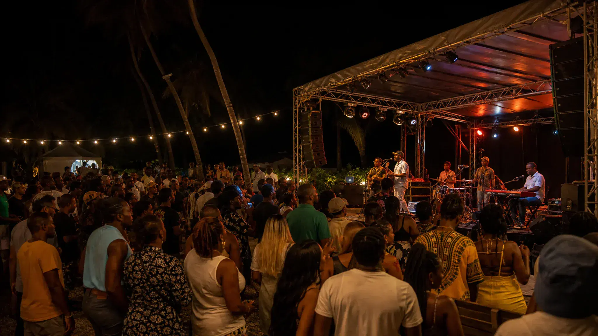 Guests enjoying a live Caribbean event at night